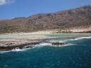 035. Balos Bay - (Η λιμνοθάλασσα Μπάλος). The lagoon of exceptional beauty with warm water of different hues from tender-blue to intense green. It’s a true paradise for children who enjoy making sandcastles and gamboling in shallowness for hours. Some shoal places turn into natural baths when the water is heated enough by the sun. Gramvousa-Balos cruise. The North-Western tip of Crete