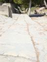 056. Royal road - The road was very well built. It was about 3.8 meters wide and lay on a layer of rough stones that was about half a meter deep, set in a sort of concrete made of clay with the addition of potsherds and small pebbles. This road leads to the Theatre Area. Knossos (Κνωσσός)