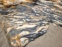 15. Stone with ‘sea waves’ - Hornstone. Such remarkable stones decorate Aghios Ioannis beach.
