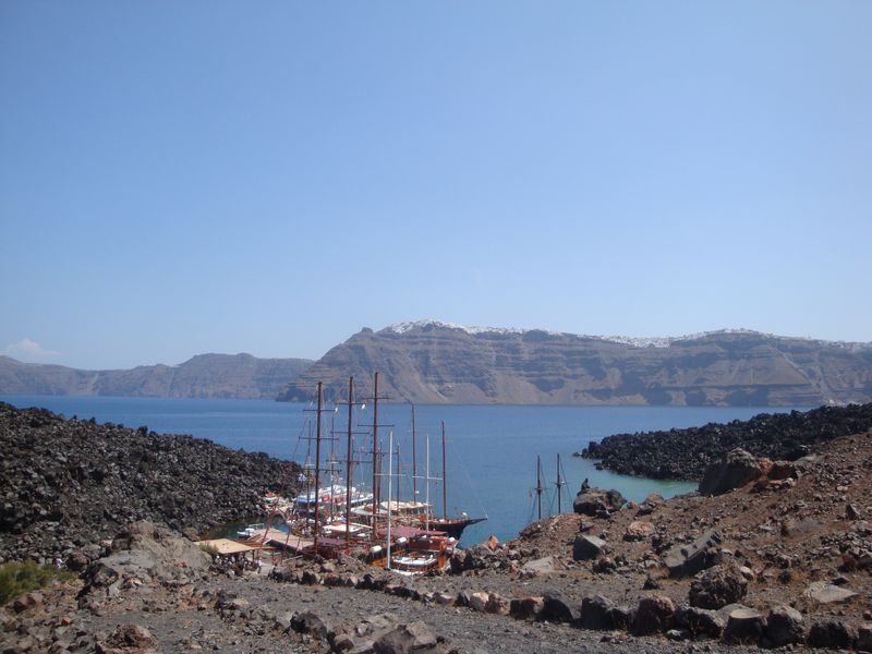 Ships in the harbor at the foot of the volcano, Nea Kameni island