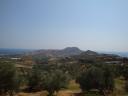 002. South Crete, Damnoni and Plakias beaches - On the left there is Damnoni beach (η παραλία Δαμνόνι), on the right there is Plakias beach (η παραλία Πλακιάς), Rethymno (Ρέθυμνο). South Crete is wayward, wild and beautiful! There are long belts of clean and empty beaches. Not many people. Silence, beauty, and calmness! The climate is drier and therefore it is better than in the north of Crete. There is no stifling and soggy heat here so it is easier to endure July hot. The place works fine for families with children. The Libyan sea is almost invariably calm, without waves, but the water is a bit colder (can’t say like ‘newly drawn milk’) because of the mountain rivers emptying themselves into the sea. You should remember that there is much less entertainment here than in the North Crete. It is quite difficult and takes a long while to get somewhere from South Crete by car or bus because of its serpentine roads.