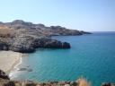 025. Ammoudi bay - Occupied by nudists. A big bright green lizard with its family was noticed nearby.
