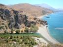 043. View on the Palm Beach - In other words, Finikas beach (φοινικόδασος). There is striking contrast of green and blue water where the river Megalos Potamos falls into the Libyan sea and where the Kourtaliotiko gorge (Κουρταλιώτικο φαράγγι) ends.