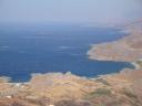 078. Surfs on the water - Because of the strong wind, the water swells and rushes from the shore though there are no big waves. On the way to Timios Stavros church (Τίμιος Σταυρός).